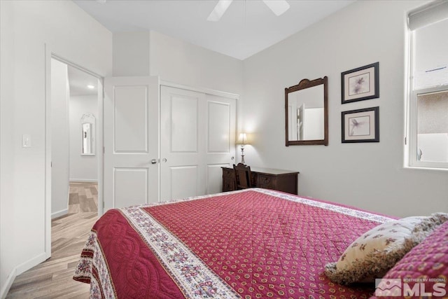 8555 Spearhead Way, Reno, NV 89506 - bedroom with a closet, wood finished floors, baseboards, and ceiling fan