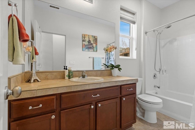 8555 Spearhead Way, Reno, NV 89506 - bathroom with toilet, vanity, tile patterned floors, and tub / shower combination