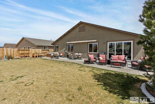 8555 Spearhead Way, Reno, NV 89506 - back of property featuring an outdoor living space, stucco siding, and a patio