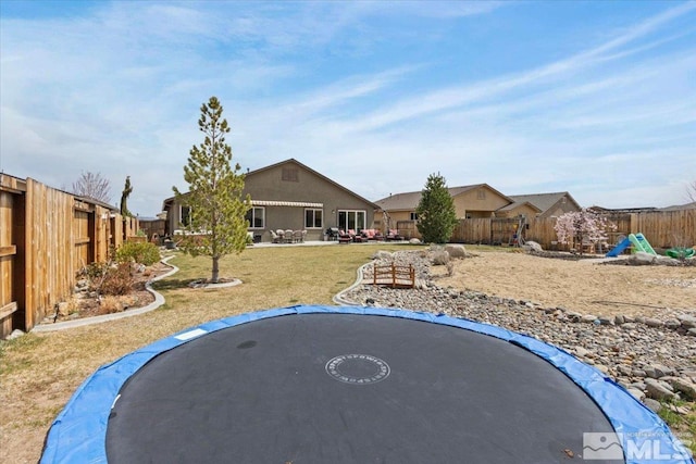 8555 Spearhead Way, Reno, NV 89506 - view of yard featuring a trampoline and a patio