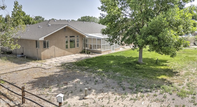 5375 Vinewood Cir, Fallon, NV 89406 - back of house with a sunroom, roof with shingles, a yard, and stucco siding
