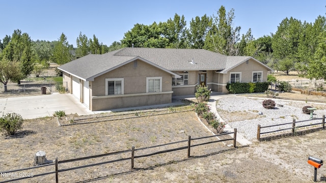 5375 Vinewood Cir, Fallon, NV 89406 - ranch-style home with concrete driveway, stucco siding, an attached garage, and roof with shingles