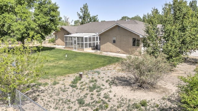 5375 Vinewood Cir, Fallon, NV 89406 - back of property with glass enclosure and stucco siding