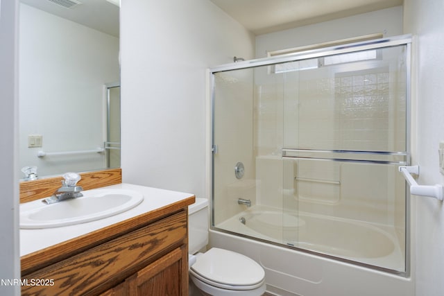 5375 Vinewood Cir, Fallon, NV 89406 - bathroom with vanity, toilet, and bath / shower combo with glass door