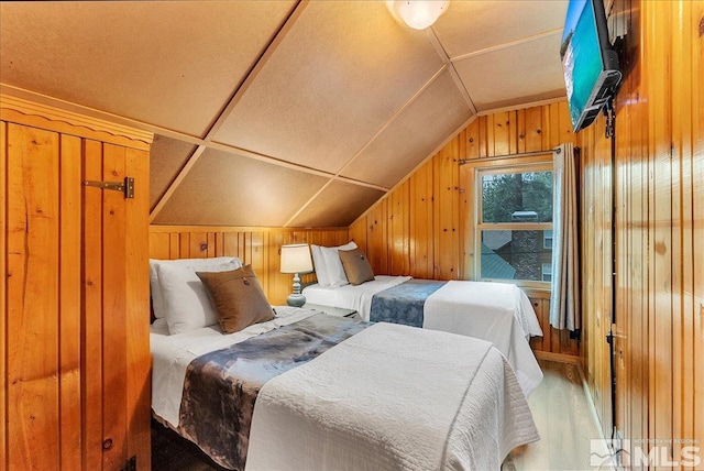 3628 Forest Ave, South Lake Tahoe, CA 96150 - bedroom featuring wood walls, vaulted ceiling, and wood finished floors
