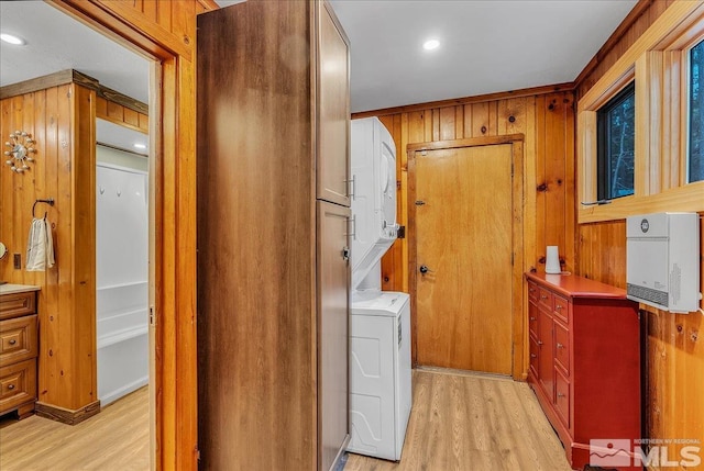 3628 Forest Ave, South Lake Tahoe, CA 96150 - laundry room with light wood finished floors, wooden walls, and stacked washer / drying machine
