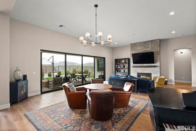 3019 Copper Stone Dr, Reno, NV 89521 - living area with a fireplace, a chandelier, light wood-style floors, baseboards, and recessed lighting