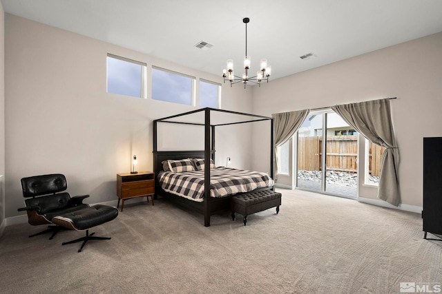 3019 Copper Stone Dr, Reno, NV 89521 - carpeted bedroom with a chandelier, access to exterior, and baseboards