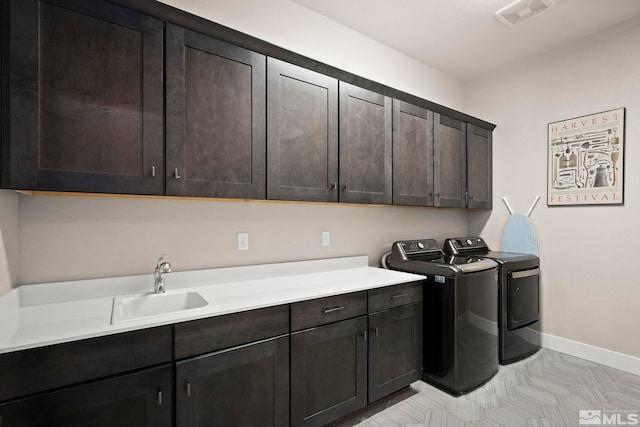 3019 Copper Stone Dr, Reno, NV 89521 - washroom featuring cabinet space, washer and clothes dryer, and baseboards