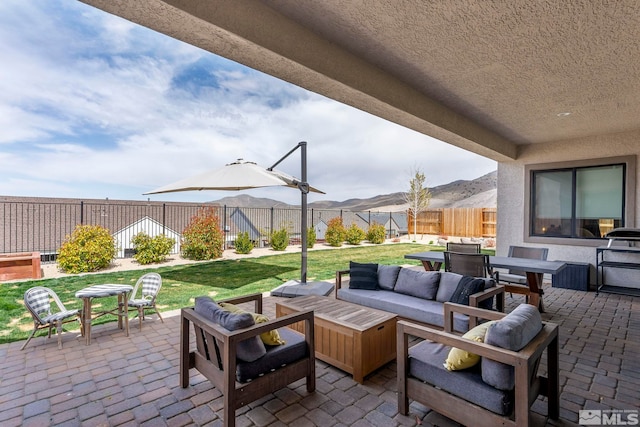 3019 Copper Stone Dr, Reno, NV 89521 - view of patio with outdoor dining area, outdoor lounge area, and a mountain view