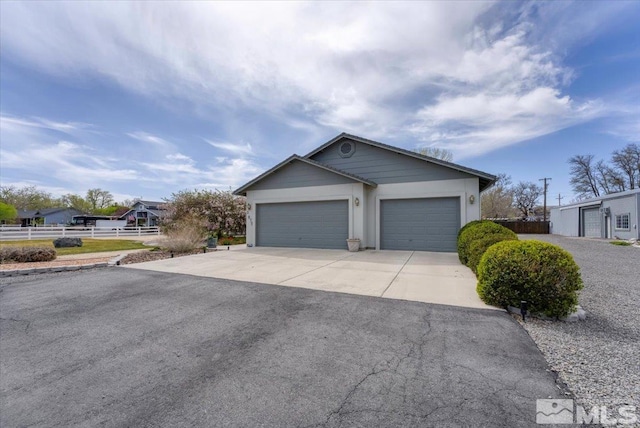 2875 Waegle Way, Fernley, NV 89408 - single story home with fence, driveway, and a garage