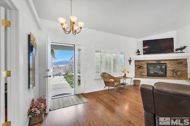 2875 Waegle Way, Fernley, NV 89408 - living room with a chandelier, wood finished floors, a fireplace, and baseboards