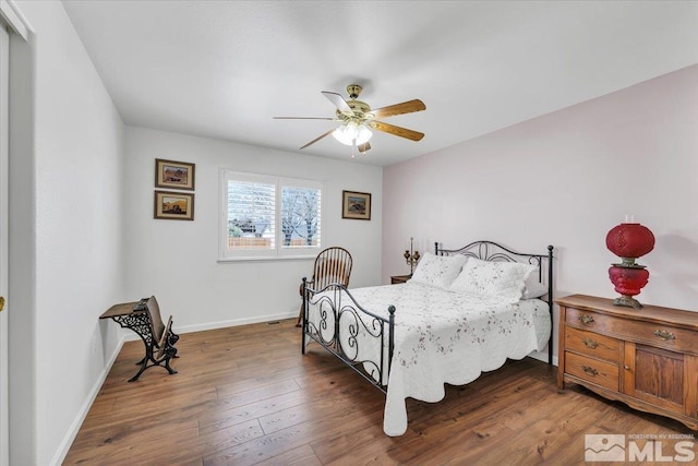2875 Waegle Way, Fernley, NV 89408 - bedroom with baseboards, wood finished floors, and a ceiling fan
