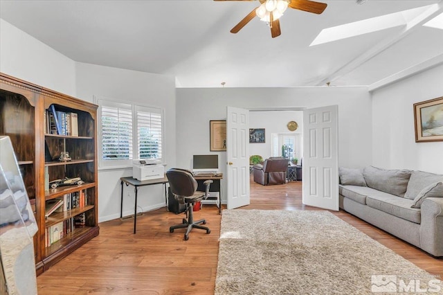 2875 Waegle Way, Fernley, NV 89408 - office area with ceiling fan, a skylight, and wood finished floors
