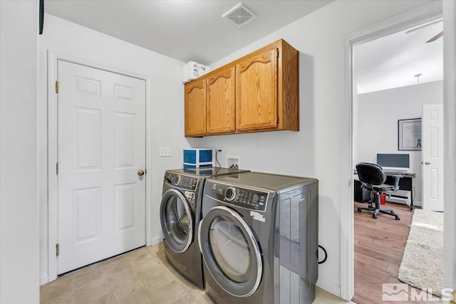 2875 Waegle Way, Fernley, NV 89408 - laundry room featuring washer and dryer, an office area, and cabinet space