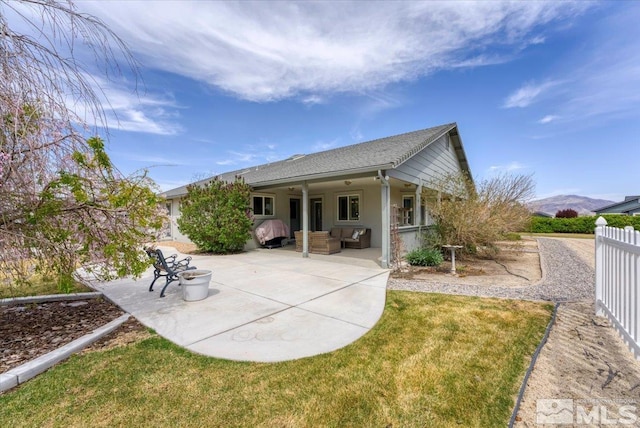 2875 Waegle Way, Fernley, NV 89408 - back of property with an outdoor living space, a patio, stucco siding, and a shingled roof