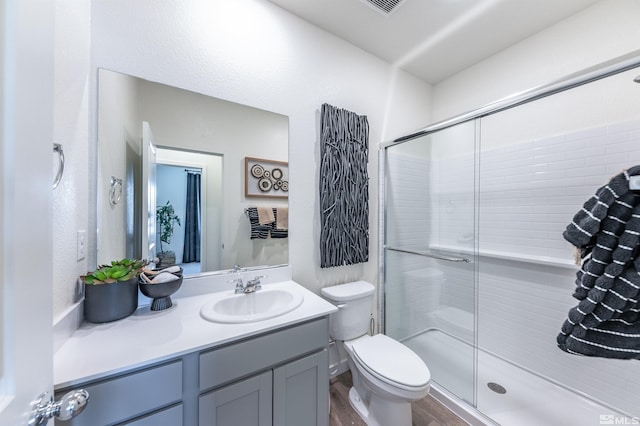 7605 Apex Pl Lot # 112, Reno, NV 89506 - full bath featuring a stall shower, toilet, vanity, and wood finished floors
