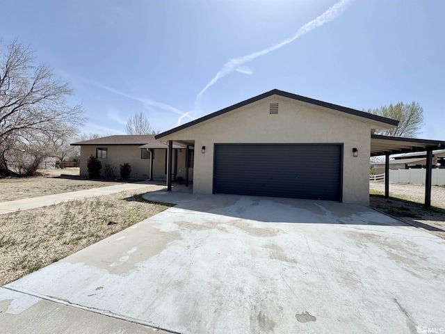 3003 Alcorn Rd, Fallon, NV 89406 - ranch-style house featuring a garage, stucco siding, driveway, and fence