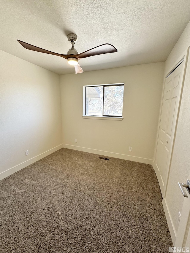 3003 Alcorn Rd, Fallon, NV 89406 - unfurnished room featuring carpet floors, a ceiling fan, baseboards, and a textured ceiling