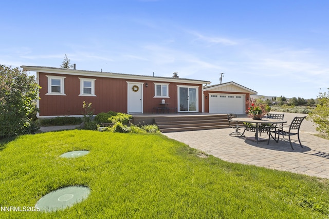 15900 Curtis Ln, Reno, NV 89511 - view of front of house featuring a garage, a front yard, and a patio