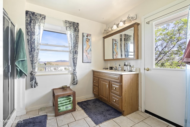 15900 Curtis Ln, Reno, NV 89511 - bathroom featuring vanity, tile patterned flooring, baseboards, and a mountain view