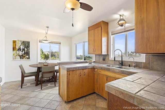 15900 Curtis Ln, Reno, NV 89511 - kitchen featuring a sink, a peninsula, healthy amount of natural light, and backsplash