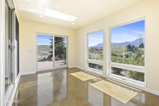 15900 Curtis Ln, Reno, NV 89511 - unfurnished sunroom with a mountain view, concrete floors, a skylight, baseboards, and recessed lighting