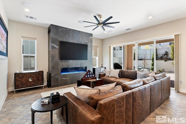 6103 S Pleasant Oak Trl, Reno, NV 89511 - living area with ceiling fan, baseboards, a high end fireplace, and recessed lighting