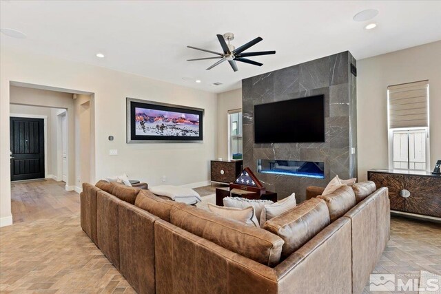 6103 S Pleasant Oak Trl, Reno, NV 89511 - living room with a ceiling fan, recessed lighting, baseboards, and a fireplace