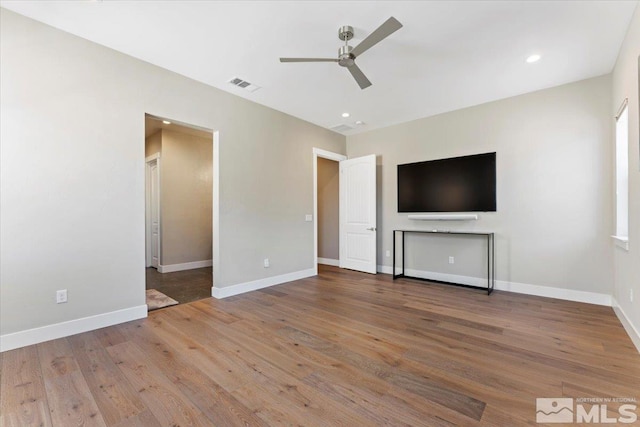 6103 S Pleasant Oak Trl, Reno, NV 89511 - unfurnished living room with ceiling fan, wood finished floors, baseboards, and recessed lighting