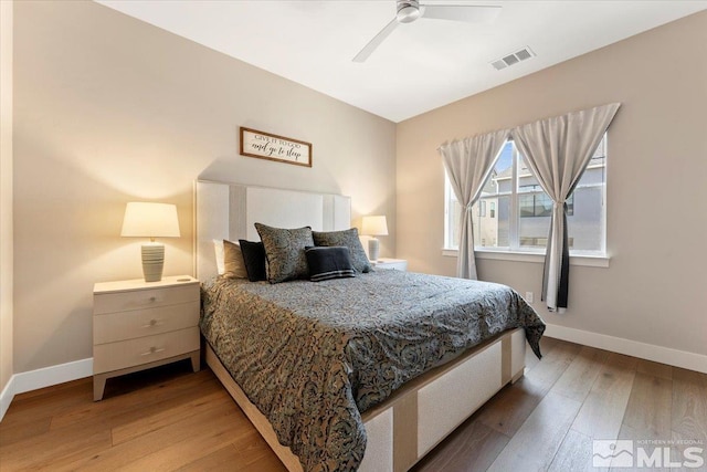 6103 S Pleasant Oak Trl, Reno, NV 89511 - bedroom with light wood-style flooring, baseboards, and ceiling fan