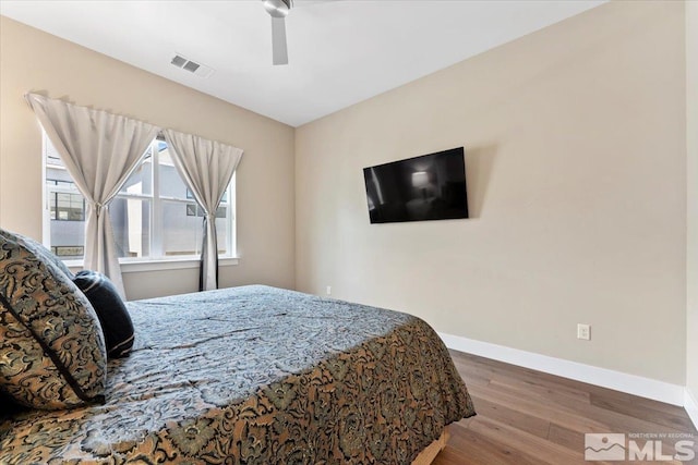 6103 S Pleasant Oak Trl, Reno, NV 89511 - bedroom featuring wood finished floors, baseboards, and a ceiling fan
