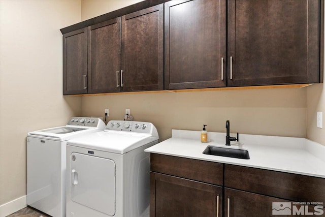 6103 S Pleasant Oak Trl, Reno, NV 89511 - clothes washing area featuring cabinet space, washing machine and dryer, and baseboards