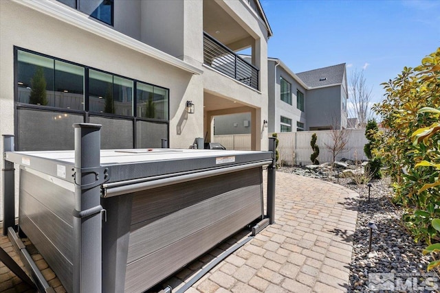 6103 S Pleasant Oak Trl, Reno, NV 89511 - view of patio featuring a hot tub and fence