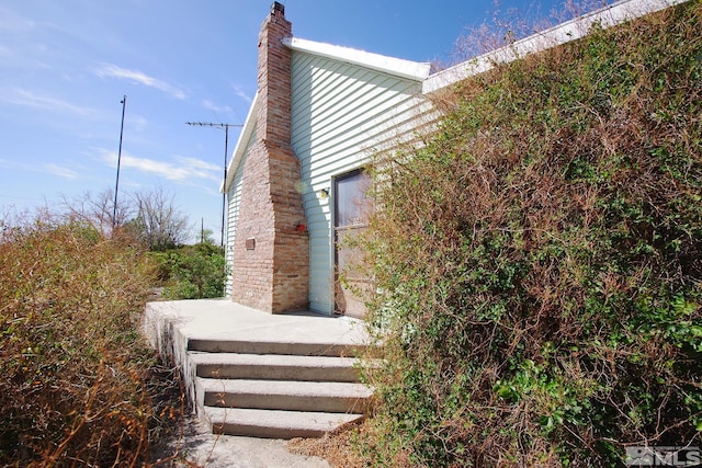 608 A St, Mina, NV 89422 - view of home's exterior featuring a chimney