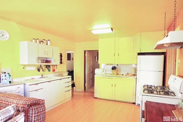 608 A St, Mina, NV 89422 - kitchen with white range with gas stovetop, under cabinet range hood, light wood-style floors, and light countertops