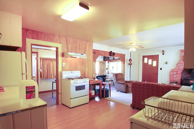 608 A St, Mina, NV 89422 - kitchen with white appliances, under cabinet range hood, light wood-style floors, open floor plan, and a ceiling fan