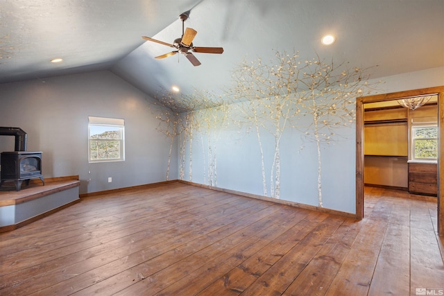 4775 Mount Rose Hwy, Reno, NV 89511 - unfurnished living room with a wood stove, a ceiling fan, lofted ceiling, wood-type flooring, and baseboards