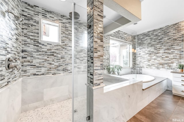 13335 Satinspar Dr, Reno, NV 89511 - bathroom with a shower stall, tile patterned flooring, a garden tub, and tile walls