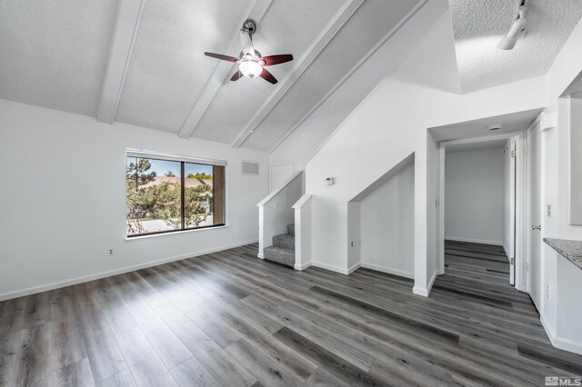 1465 E Peckham Ln Apt 20, Reno, NV 89502 - unfurnished living room featuring ceiling fan, stairs, dark wood finished floors, a textured ceiling, and baseboards