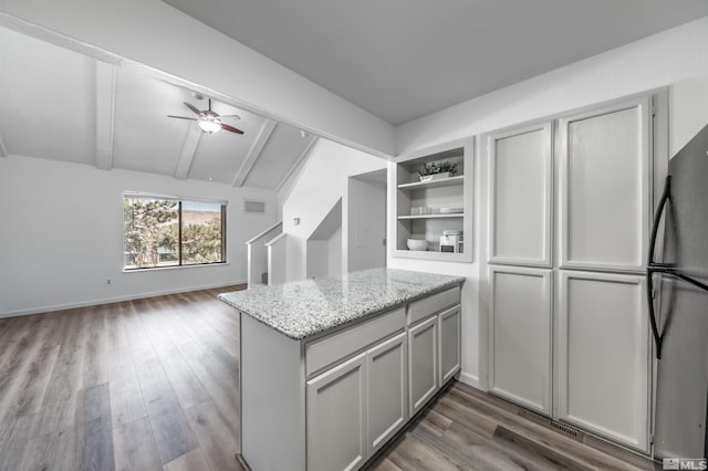 1465 E Peckham Ln Apt 20, Reno, NV 89502 - kitchen with freestanding refrigerator, open floor plan, dark wood finished floors, light stone counters, and open shelves