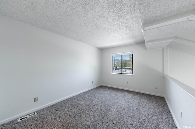 1465 E Peckham Ln Apt 20, Reno, NV 89502 - carpeted spare room featuring a textured ceiling and baseboards