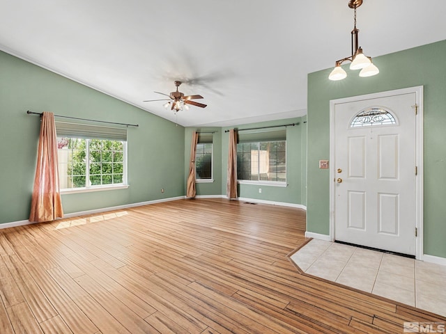 1343 White Bluffs Cir, Fernley, NV 89408 - entryway featuring lofted ceiling, light wood-style floors, ceiling fan, and baseboards