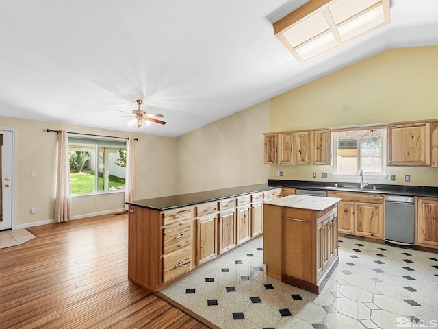 1343 White Bluffs Cir, Fernley, NV 89408 - kitchen featuring a kitchen island, a sink, dark countertops, vaulted ceiling, and a ceiling fan