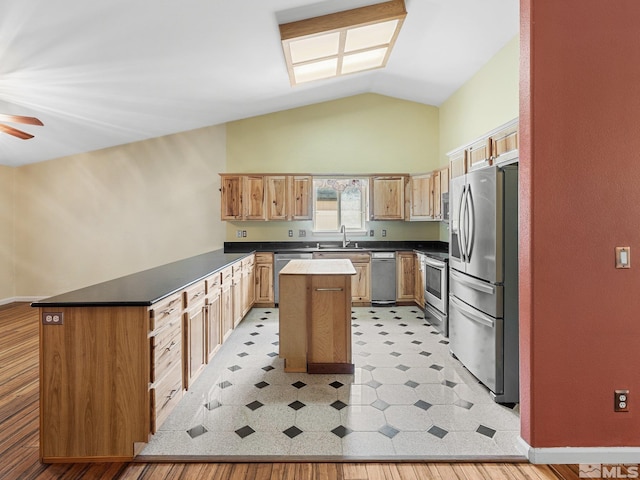 1343 White Bluffs Cir, Fernley, NV 89408 - kitchen with appliances with stainless steel finishes, a sink, ceiling fan, a peninsula, and a center island