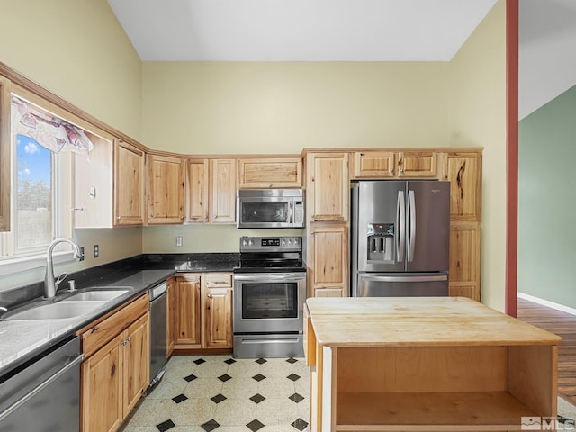 1343 White Bluffs Cir, Fernley, NV 89408 - kitchen featuring appliances with stainless steel finishes, a sink, light flooring, wooden counters, and light brown cabinets