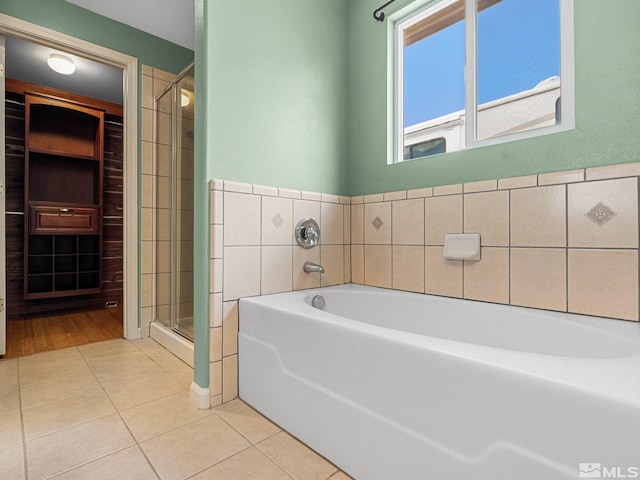 1343 White Bluffs Cir, Fernley, NV 89408 - full bathroom featuring tile patterned floors, a stall shower, and a bath