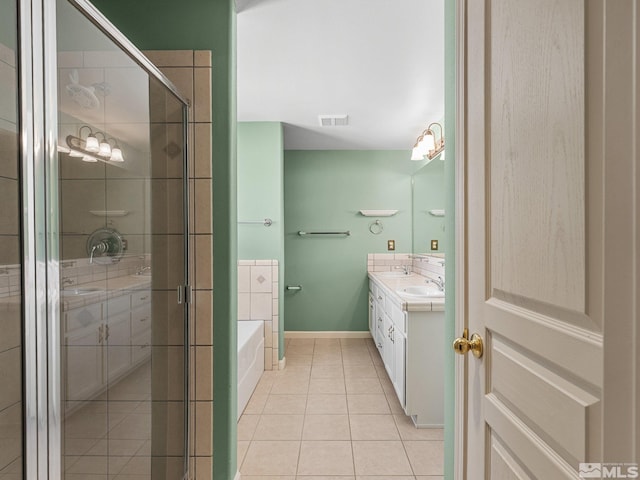 1343 White Bluffs Cir, Fernley, NV 89408 - bathroom featuring vanity, tile patterned flooring, a shower stall, and a garden tub