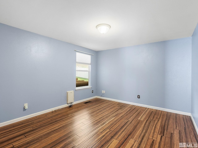 1343 White Bluffs Cir, Fernley, NV 89408 - unfurnished room with wood finished floors and baseboards