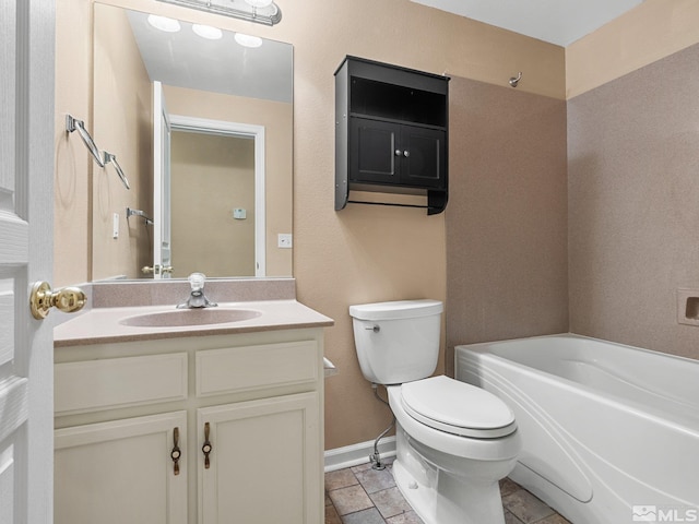 1343 White Bluffs Cir, Fernley, NV 89408 - full bath featuring toilet, vanity, baseboards, and stone finish floors